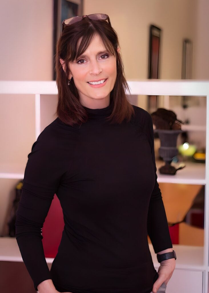 Norma Kolson stands near the entrance to the Datachieve Digital office