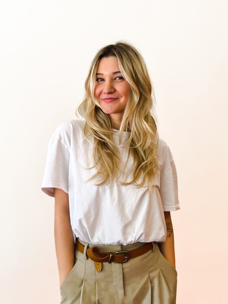 Taylor Clowser stands near the entrance to the Datachieve Digital office