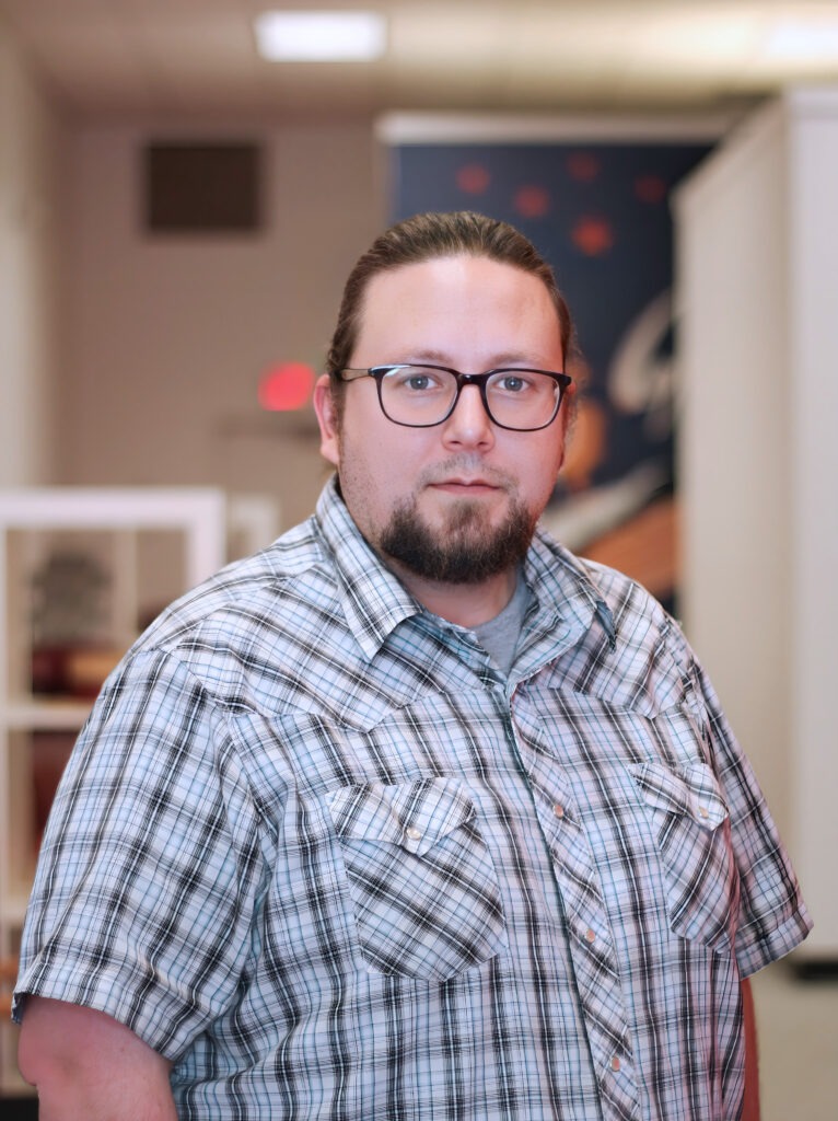 Matt Matzen stands near the entrance to the Datachieve Digital office